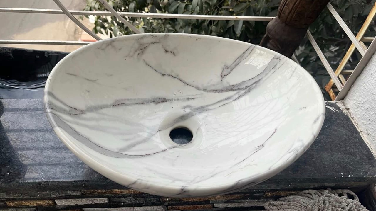 WhatsApp Image 2025-12-02 at 16.46.40_651e686e Marble-Finish Oval Wash Basin – Premium Designer Countertop Sink - Image 1